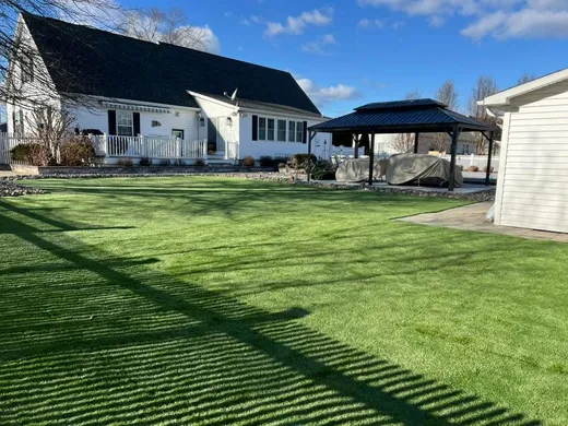 Newly installed artificial turf backyard lawn