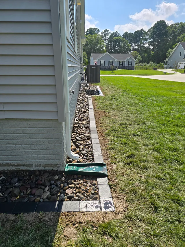 Downspout drain trench with paver edging