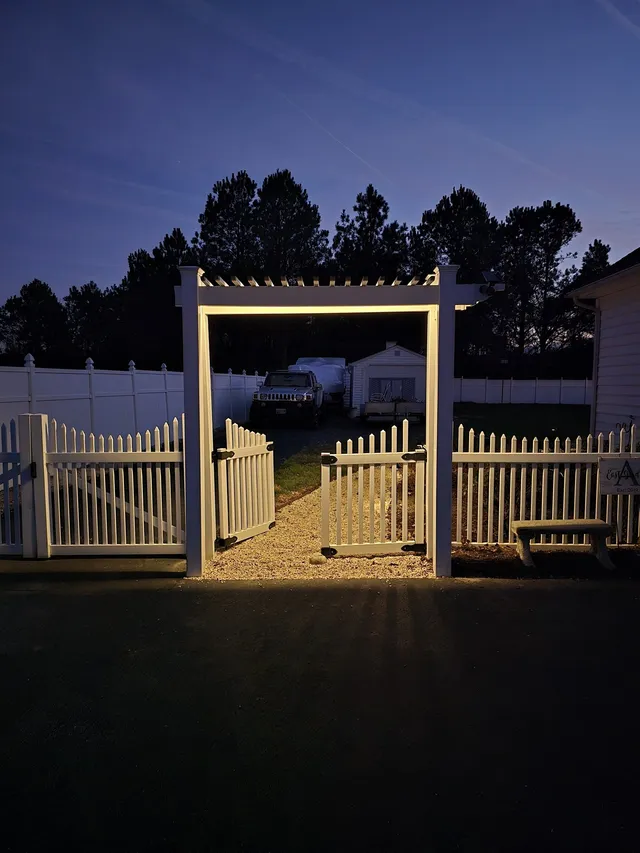Landscape lighting on a pergola arbor at dusk