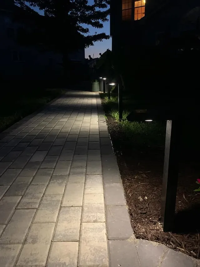 Path lighting along a paver walkway at night